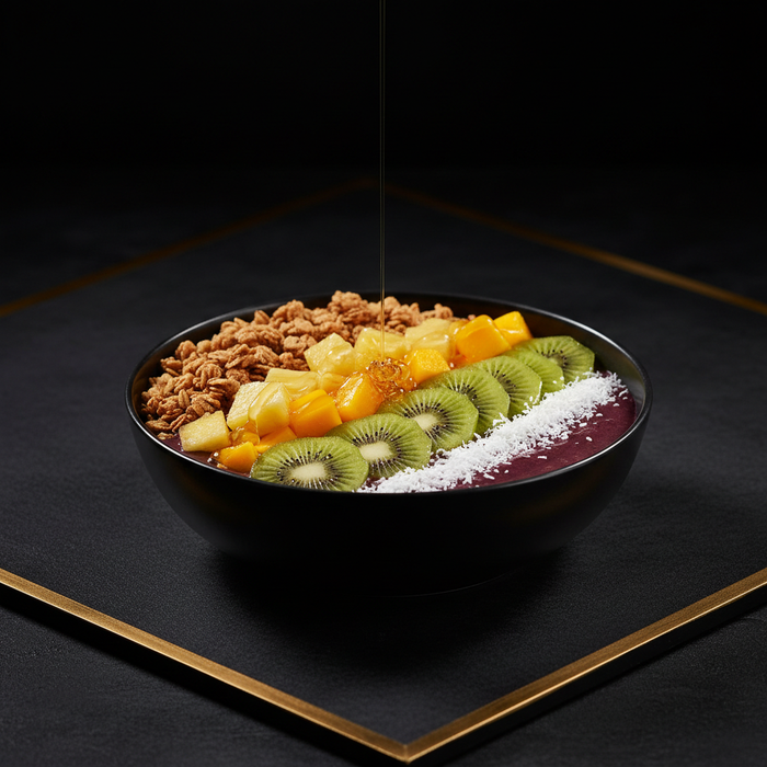 Kiwi Fusion Acai Bowl with granola, pineapple, mango, kiwi, coconut flakes, and honey